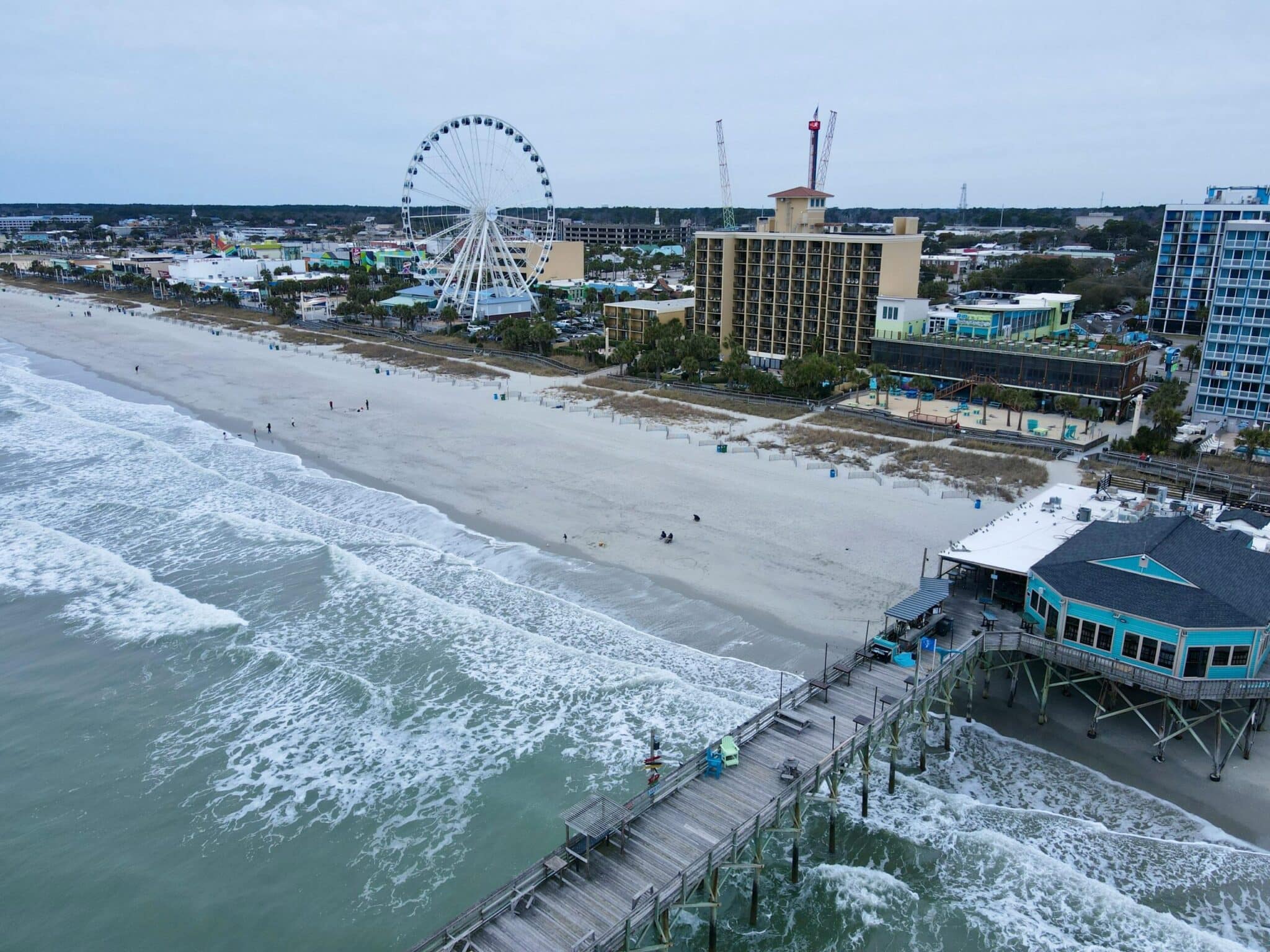 an aerial view of the ferris wheel at myrtle beach